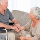 caregiver after care patient on a wheelchair