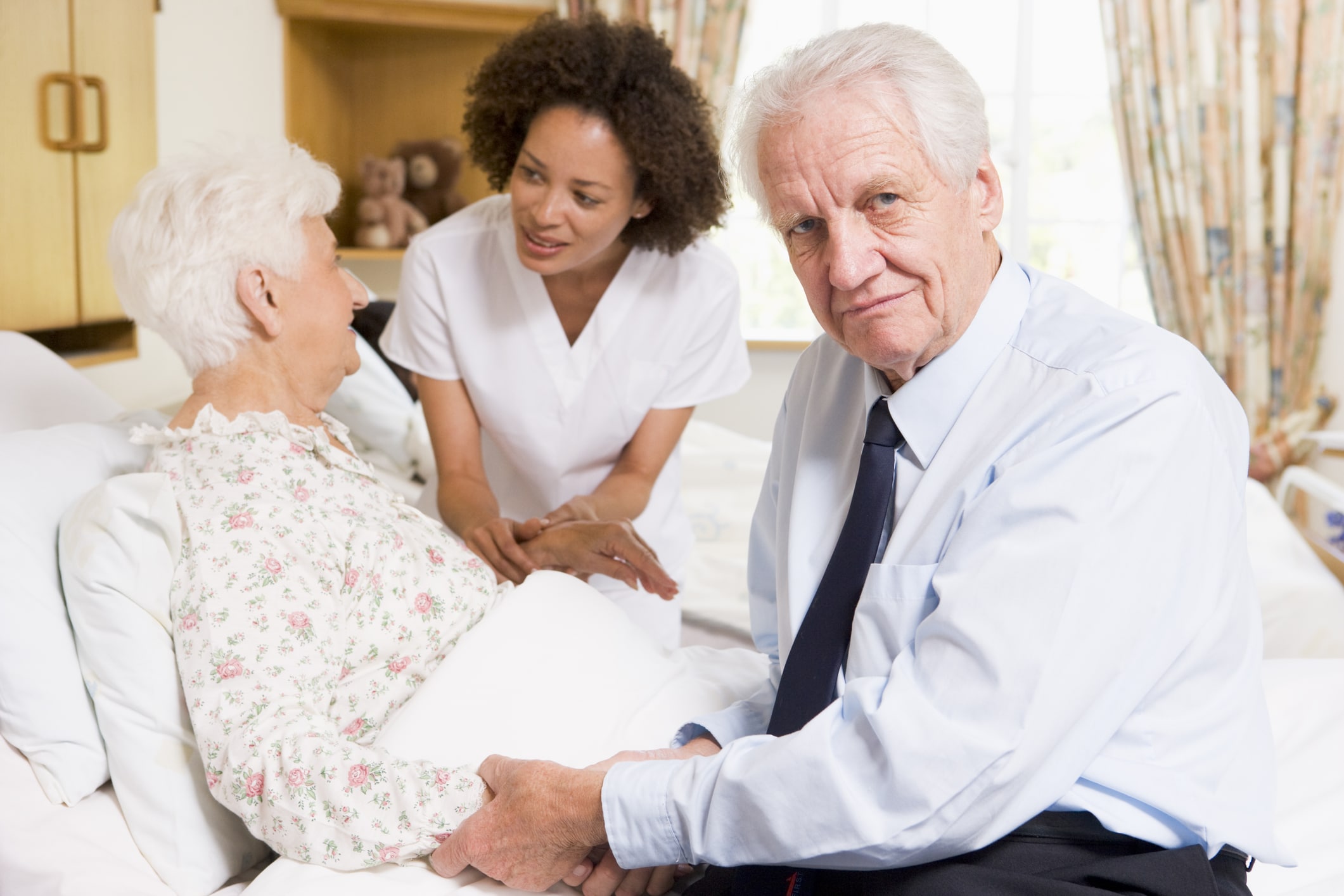 caregiver after care patient on a wheelchair