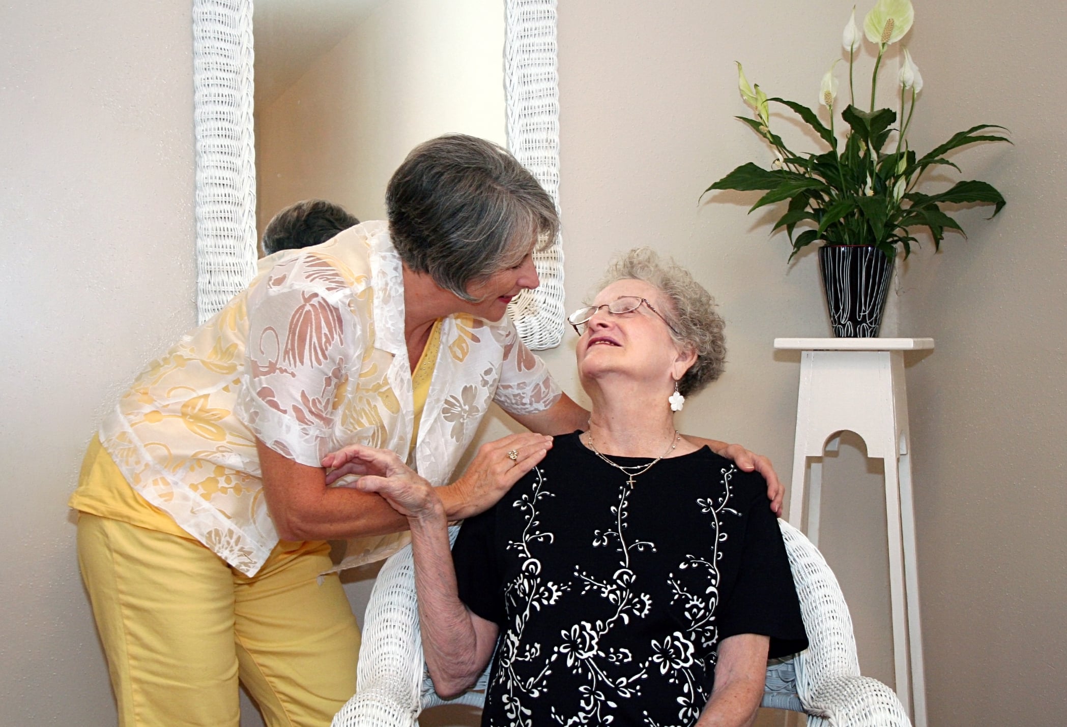 elder patient with walking aid assisted by nurse