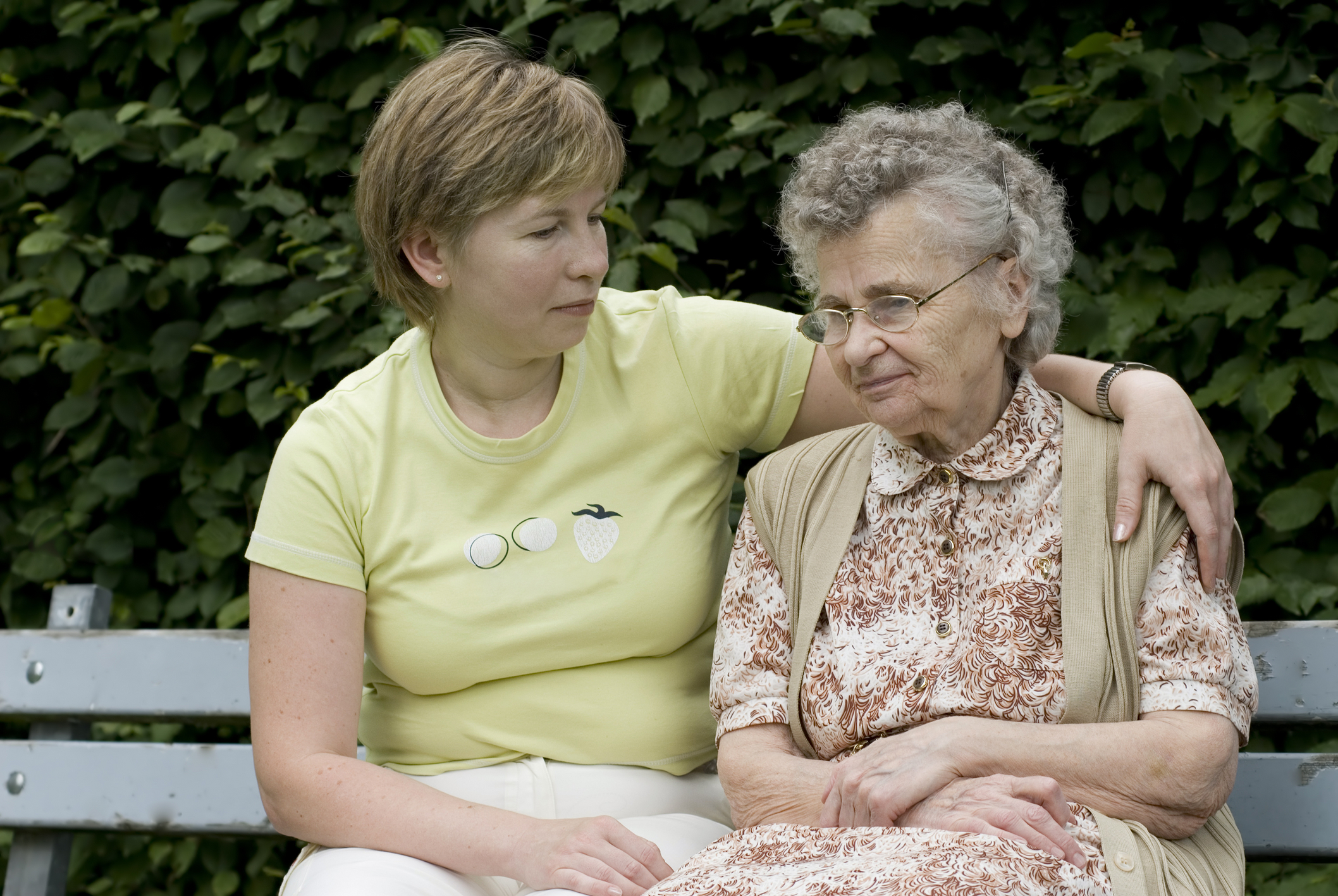 patient with walking aid assisted by nurse