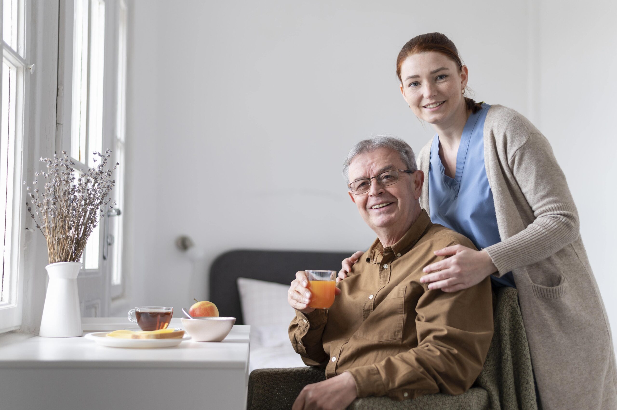 caregiver after care patient on a wheelchair