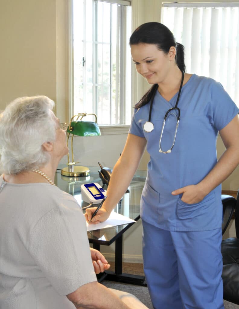Nurse conducting medical check-up, attentively noting elder patient's comments
