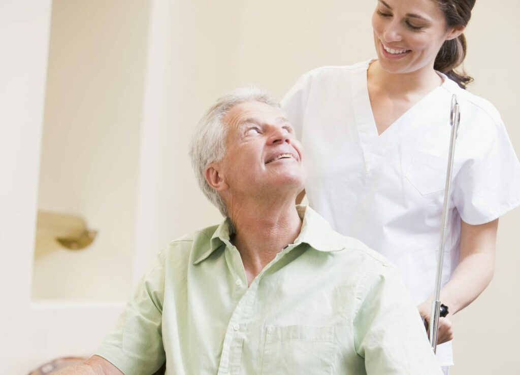 Nurse pushing patient on a wheelchair