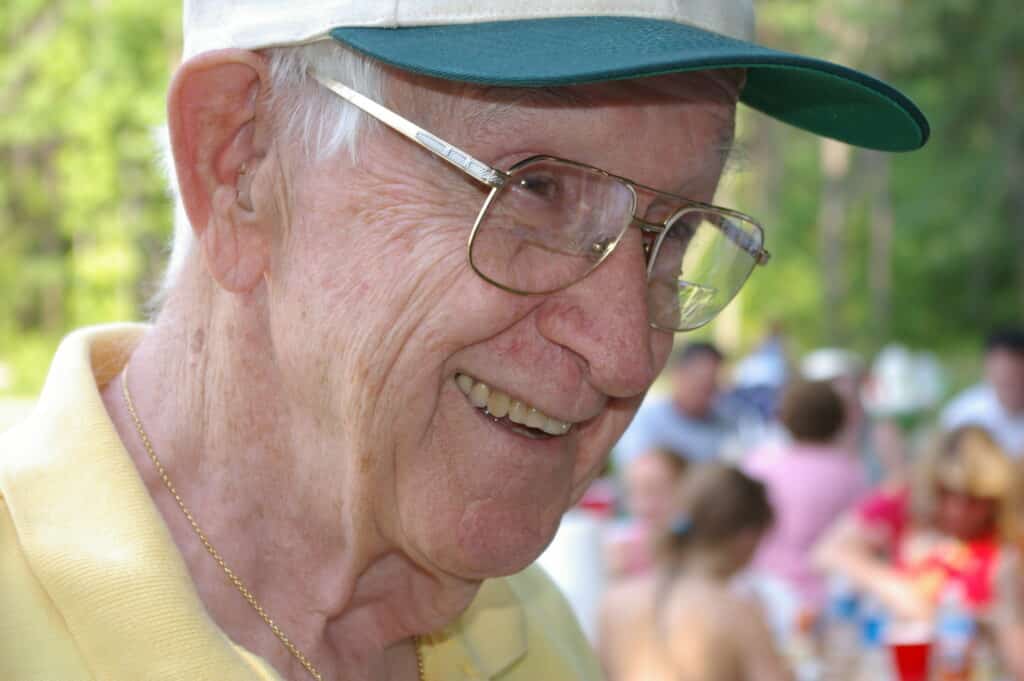 Elderly person with glasses, getting eyes checked.